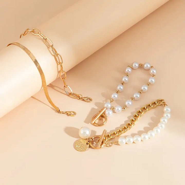 Elegant 4-Piece Gold Bracelet Set – Snake, Pearls and Links